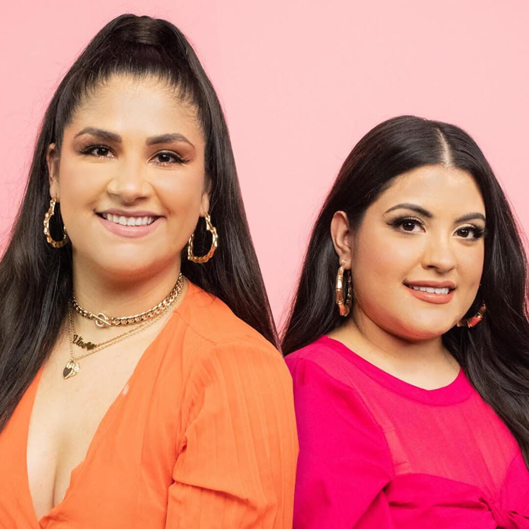 Studio portrait of Joanna Rosario-Rocha and Leslie Valdiva on light pink background Desktop