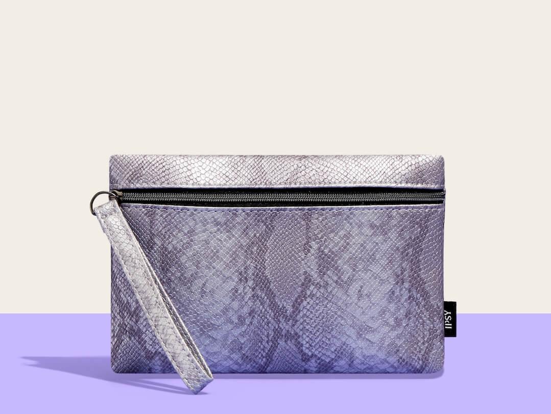 November 2024 IPSY Glam Bag over a purple and beige background