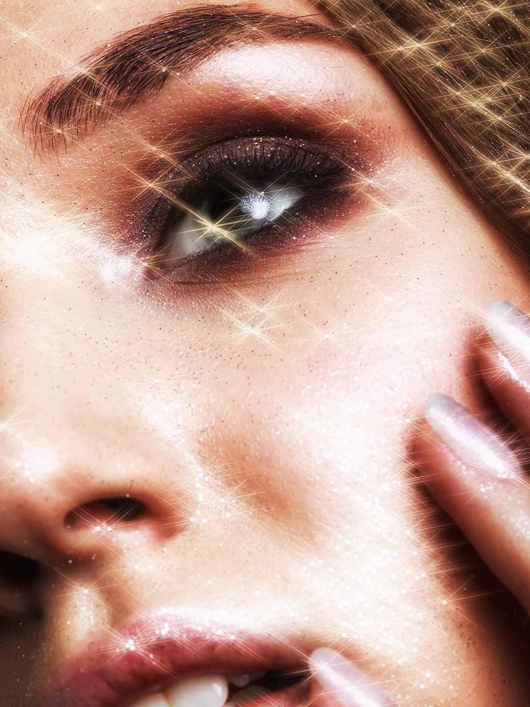 Close-up of beautiful young woman with vogue shining sparkle face makeup Desktop