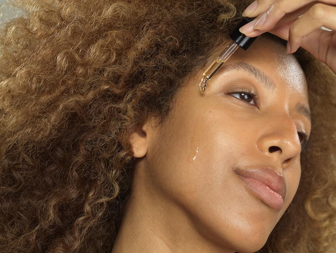 Closeup images of a woman applying hyaluronic acid on face