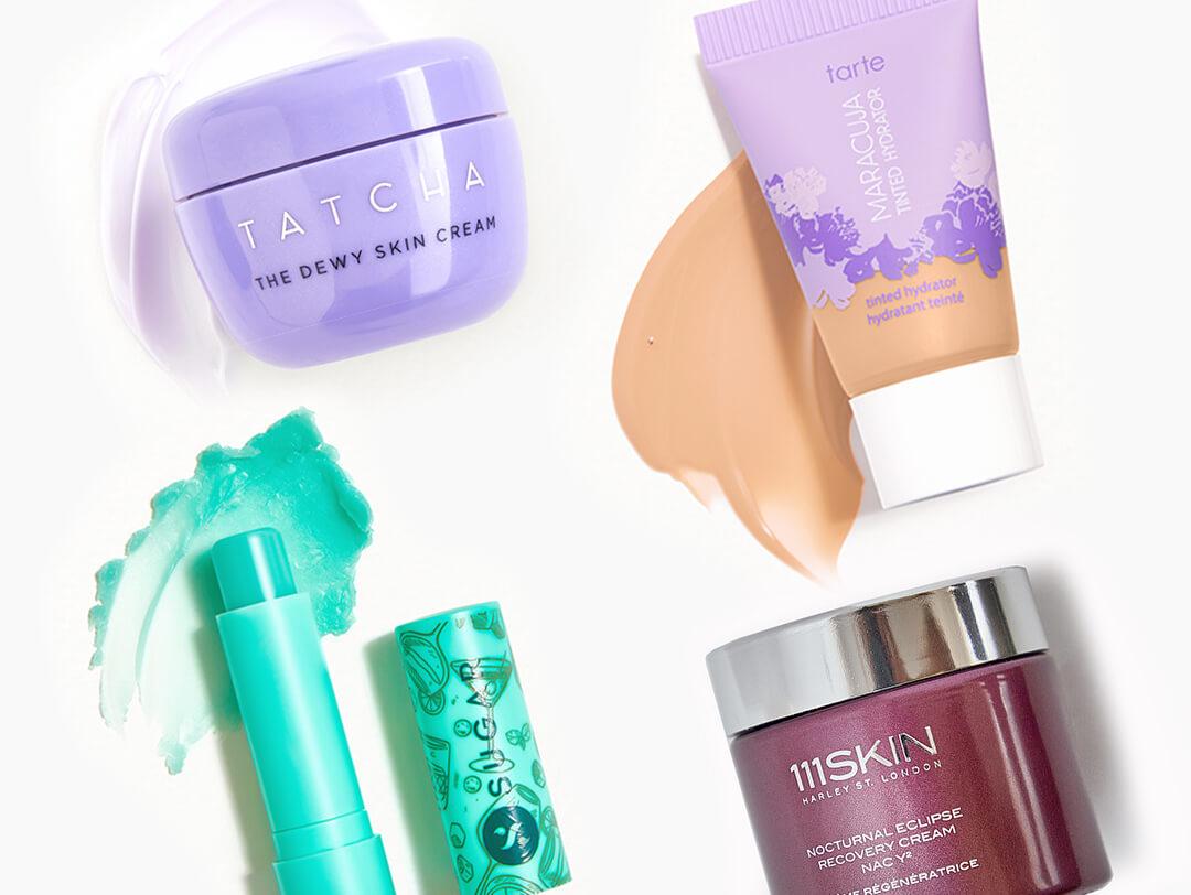 TATCHA The Dewy Skin Cream, SUGAR COSMETICS Tipsy Lips Moisturizing Balm in Mojito, TARTE Maracuja Tinted Hydrator, and 111SKIN Nocturnal Eclipse Recovery Cream swatched on white background