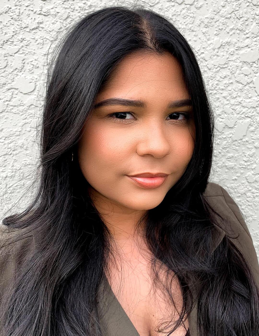 Portrait of Yashira Cancel against textured wall Desktop